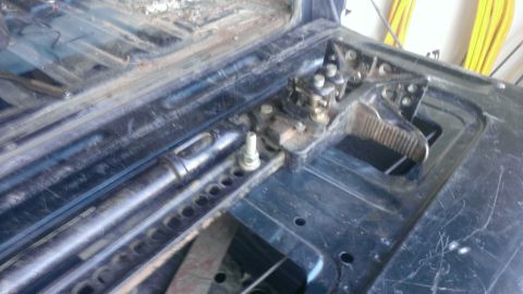 1994 Ford Bronco - Close-up of the tailgate latch mechanism on a 1994 Ford Bronco, indicating wear.