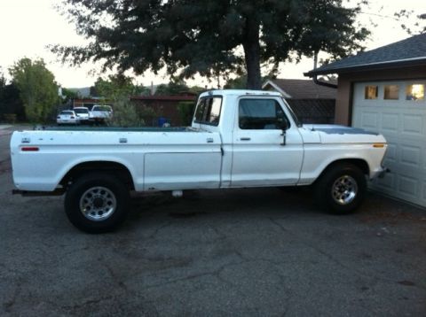 1977 Ford F-350 - Side view of a white 1977 Ford F-350 pickup truck parked in a driveway.