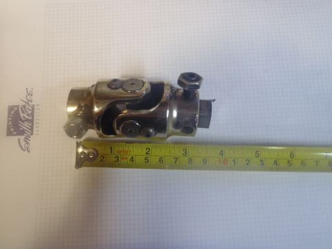1970 Ford Bronco - A close-up of a steering U-joint is shown with a tape measure for scale.