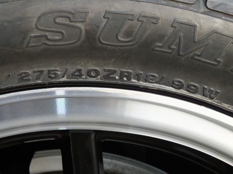 2003 Ford Crown Victoria - Close-up view of a tire and wheel assembly, showing tire size information.