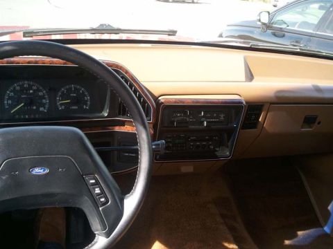 1988 Ford Bronco - Interior view of a vehicle, showing the dashboard, steering wheel, and radio controls.