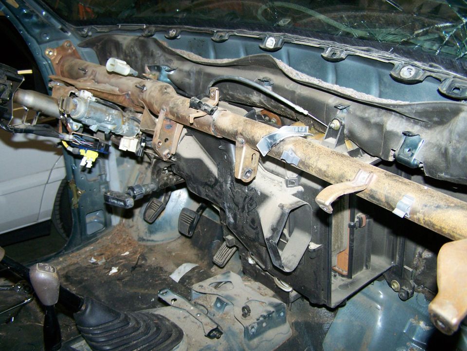 Interior view of disassembled dashboard and steering column