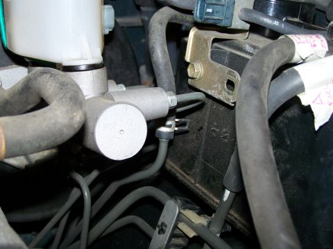 1988 Suzuki Samurai - This is a close-up view of a vehicle's brake master cylinder and associated plumbing.