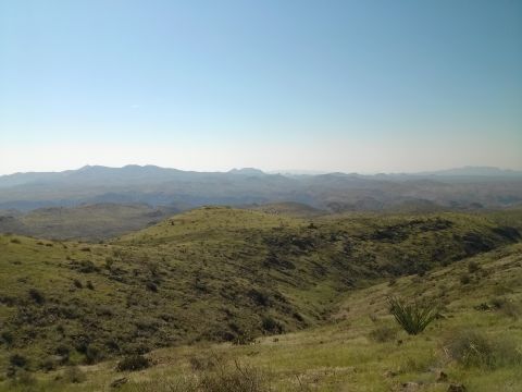 1981 Ford F-150 - Expansive view of rolling hills and distant mountains on a clear day.