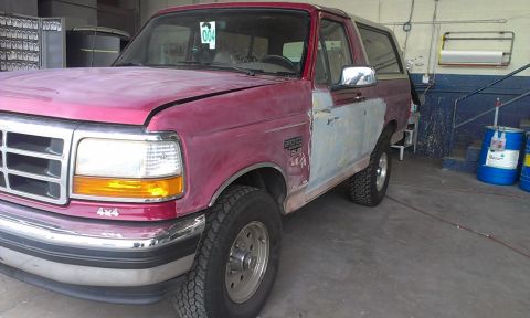 1994 Ford Bronco - This Ford Bronco appears to be undergoing bodywork, with primer visible on the passenger side.