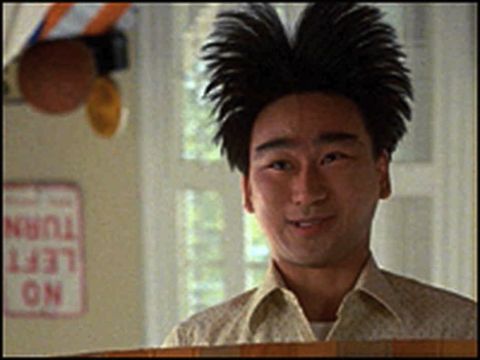 1997 Ford Ranger - A man with spiky hair smiles in front of a window, with a "No Left Turn" sign visible on the wall.