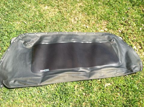 1990 Ford Bronco - Soft top with plastic window, likely for a convertible or Jeep-style vehicle, photographed on grass.