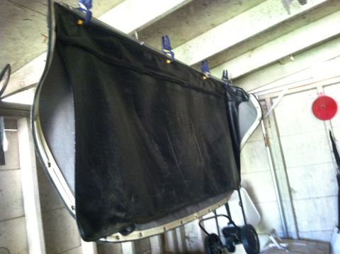 1990 Ford Bronco - A car door panel is shown hanging, possibly for repair or cleaning.