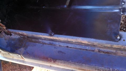 1979 Ford Bronco - Vehicle rocker panel shows rust damage and a newly welded metal repair section.