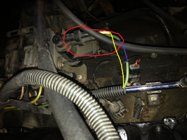 Engine bay wiring and vacuum lines, one connector circled in red