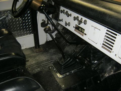 1970 Ford Bronco - Interior view of a 1970 Ford Bronco, highlighting the dashboard and floor shifter.