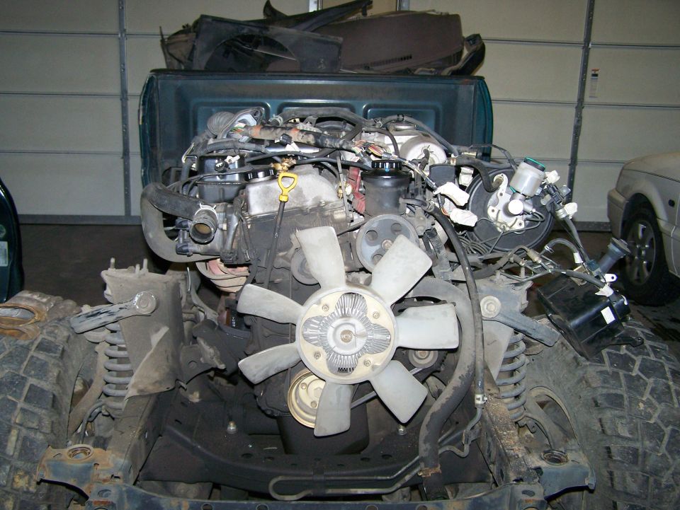 Vehicle engine and front chassis components, including suspension and fan