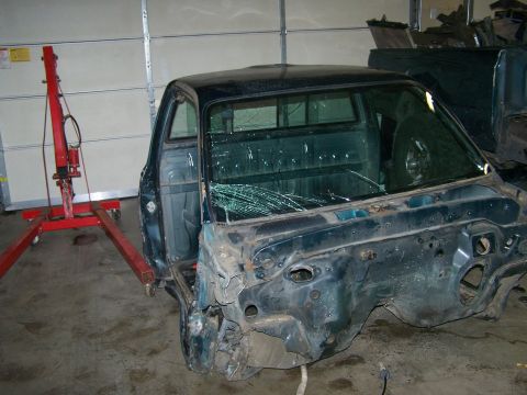 1988 Suzuki Samurai - This damaged truck cab is missing its front end and has a shattered windshield.