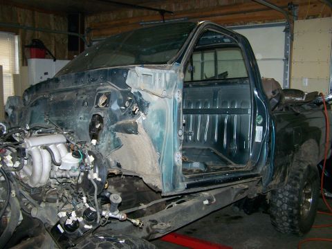 1988 Suzuki Samurai - This vehicle appears to be a pickup truck undergoing a significant modification or repair, with its engine and chassis prominently displaye…