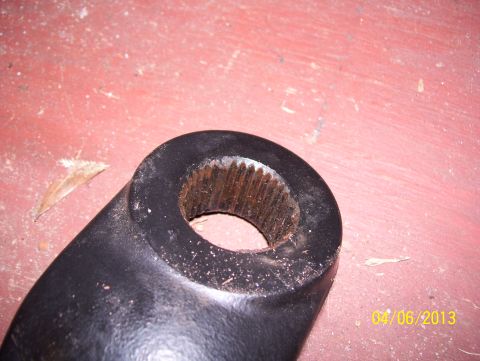 1990 Ford Bronco - A close-up view of a splined shaft housing, with a date stamp visible in the corner.
