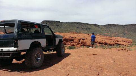 1994 Ford Bronco - Off-road Bronco with custom modifications in a desert landscape.