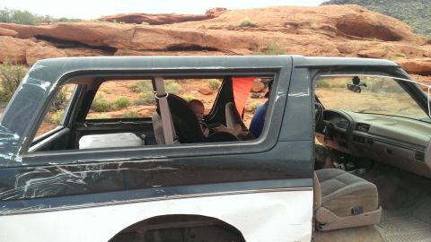 1994 Ford Bronco - Side view of a 1990s Ford Bronco interior with a baby in a car seat.