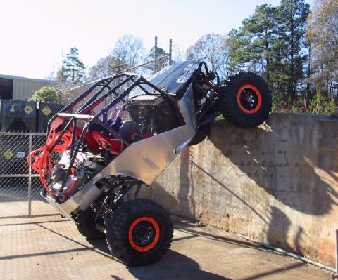 1994 Ford Bronco - Custom off-road buggy attempts to climb a steep concrete incline.