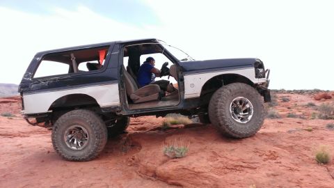 1994 Ford Bronco - This modified 1994 Ford Bronco is shown off-roading with its doors removed.