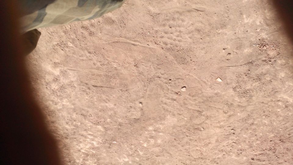 Tire tracks in dry dirt with a watermark reading SUPERMOTORS.NET