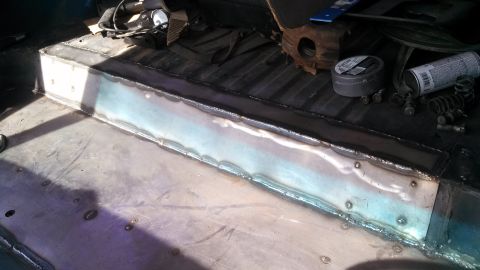 1979 Ford Bronco - Vehicle floor repair in progress, showing newly welded metal sections.