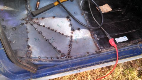 1979 Ford Bronco - Welding patches onto a vehicle's interior floor pan, marked with 'P1', 'P2', and 'P3'.