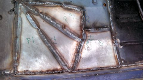 1979 Ford Bronco - Patched floor pan with handwritten labels P1, P2, P3, and 'Floor'.