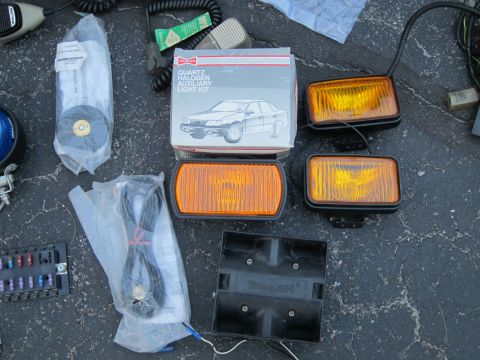 1991 Ford LTD Crown Victoria - Box for a quartz halogen auxiliary light kit, a diagram of a sedan and various light components.