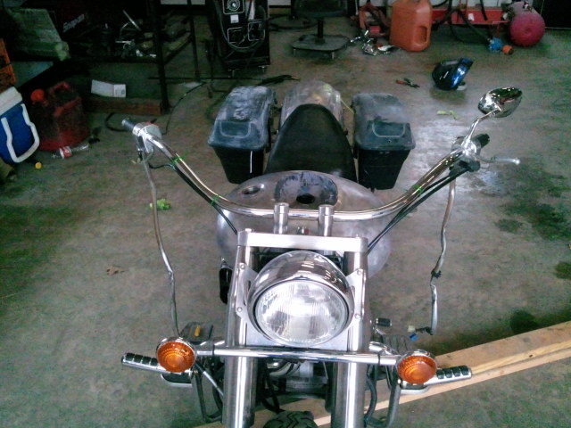 Motorcycle front view showing chrome handlebars, headlight, and turn signals