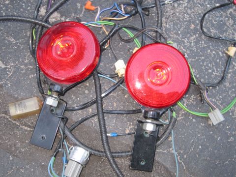 1991 Ford LTD Crown Victoria - Pair of red trailer lights with wiring harness and connectors visible.