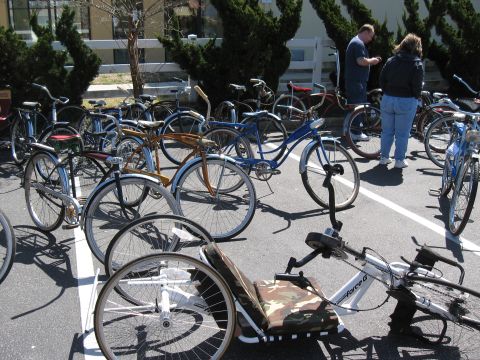 1994 Ford Bronco - A collection of bicycles and a recumbent tricycle are displayed in an outdoor setting.