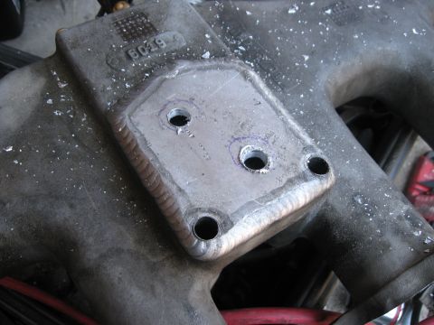 1981 Ford Bronco - Close-up of a welded metal part, possibly an intake manifold component.