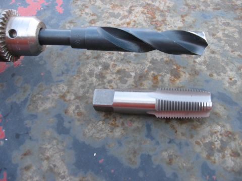 1981 Ford Bronco - Drill bit and tap tool shown on a textured surface.