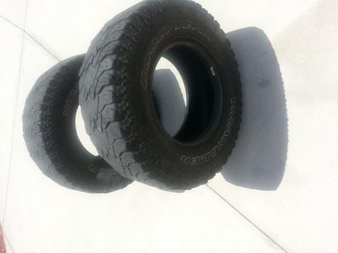 1994 Ford Bronco - Close-up view of two Goodyear Wrangler tires, one in focus and the other slightly out of frame.