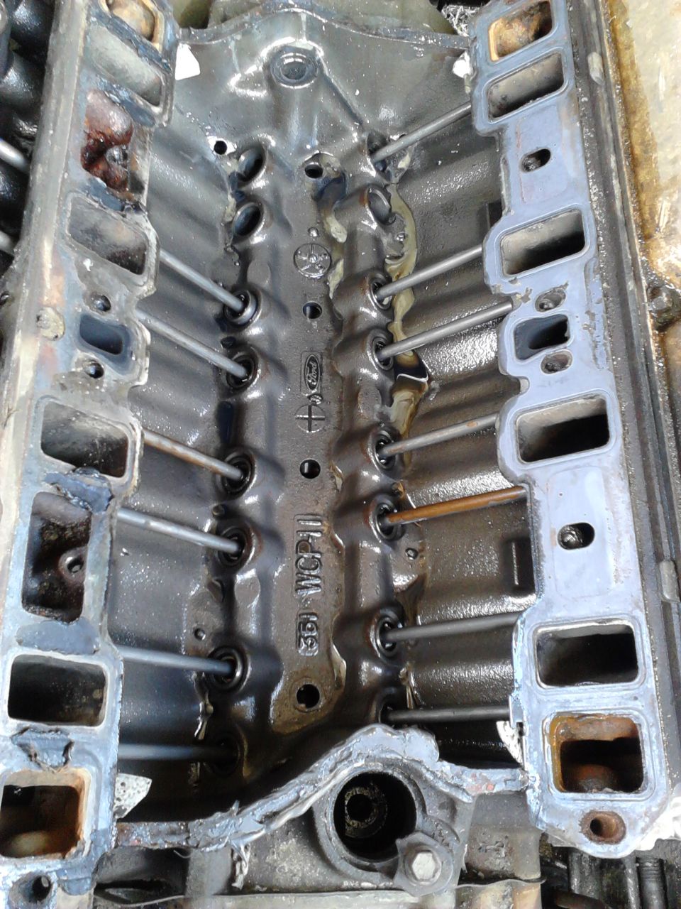 Took truck to a big mudding event. the first night I spent hours pulling trucks out because of the parking lots were so muddy and rutted. within that time the, the hose for the oil pressure gauge got caught on something and ripped out spewing all the oil out with me unknowing. When I was done I noticed the engine was making noise of low oil.

The next day I checked the oil and it wasn't on the dipstick so I added a lot of oil and didn't think twice about why because the engine burns though oil like crazy. 10 minutes of hard fun later and the engine makes a *clank clank* and dies and acts seized. took the intake off and found 3 missing pushrods and lifters. Im guessing the camshaft broke and they fell into the pan