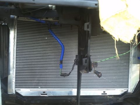 1973 Ford Ranchero - Close-up of a vehicle's radiator and associated plumbing, with visible text from a website watermark.