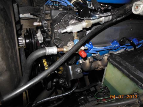 1979 Ford F-150 - Close-up of a V8 engine, showing spark plug wires, hoses, and engine components.