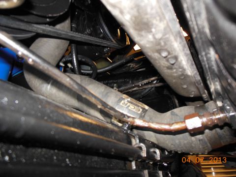 1979 Ford F-150 - Close-up view of engine bay components, including hoses and belts, with a visible date stamp.