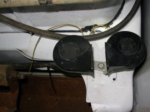 1983 Ford Bronco - Since I had them lying around, I added these horns in the LHR quarter panel and spliced in a Y from the horn relay output. The hose above t…