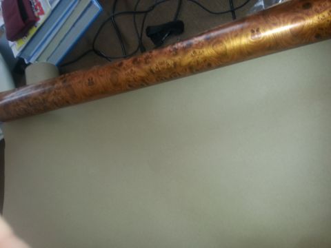 1994 Ford Bronco - A roll of wood grain hydrographic film is shown, with Supermotors.net branding visible at the bottom right.