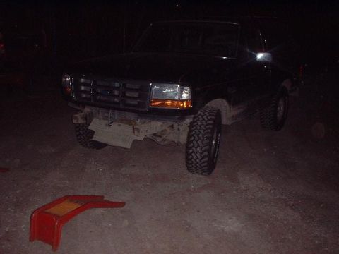 1993 Ford Bronco - 1993 Ford Bronco front view shows damage to the bumper area.
