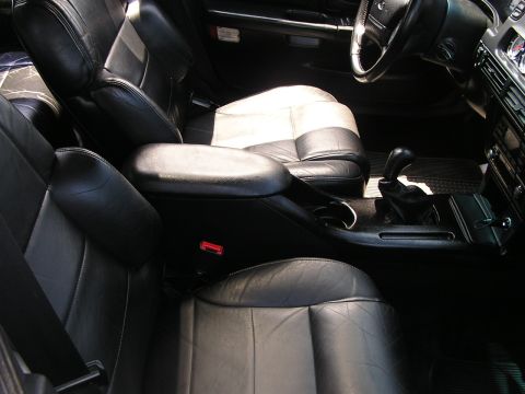 1993 Ford Taurus - Interior view of a 1993 Ford Taurus, highlighting the front seating area and dashboard controls.