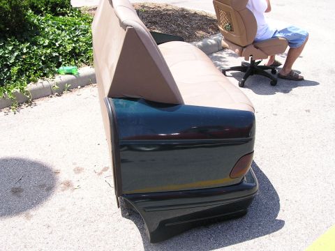 1993 Ford Taurus - A car's rear bumper and taillight assembly have been repurposed to form the base of a sofa.