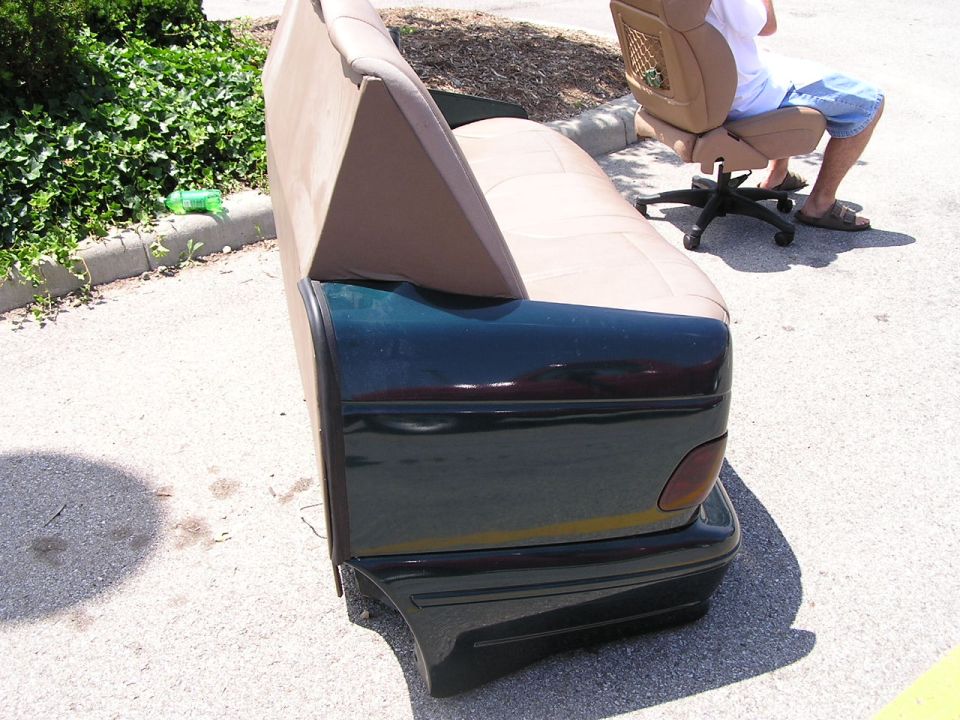 Car seat and backrest attached to a car's rear bumper and taillight section