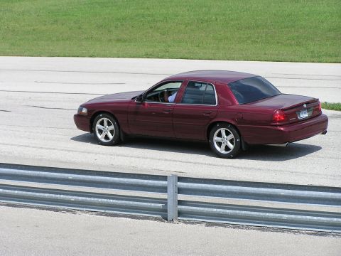 1993 Ford Taurus - This maroon sedan appears to be a 2003 model, not a 1993 Ford Taurus.