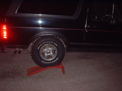 1993 Ford Bronco - This 1993 Ford Bronco is shown from the side, its distinctive red pinstripe and BFGoodrich Mud-Terrain tires.