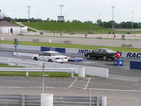 1993 Ford Taurus - Two sedans prepare for a drag race at Indianapolis Raceway Park.