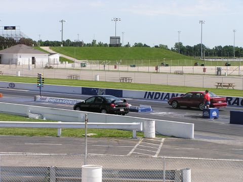 1993 Ford Taurus - A drag race is about to begin on a sunny day at the Indianapolis Motor Speedway.
