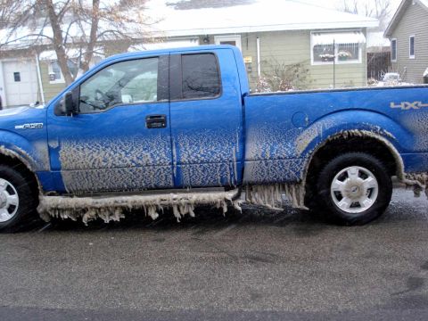 2008 Ford Crown Victoria - Pickup truck coated in ice during winter weather conditions.