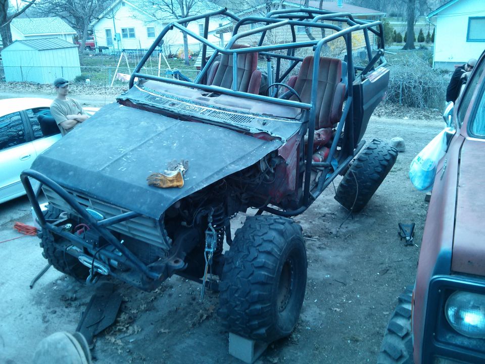 Off-road buggy with roll cage and large tires, front view